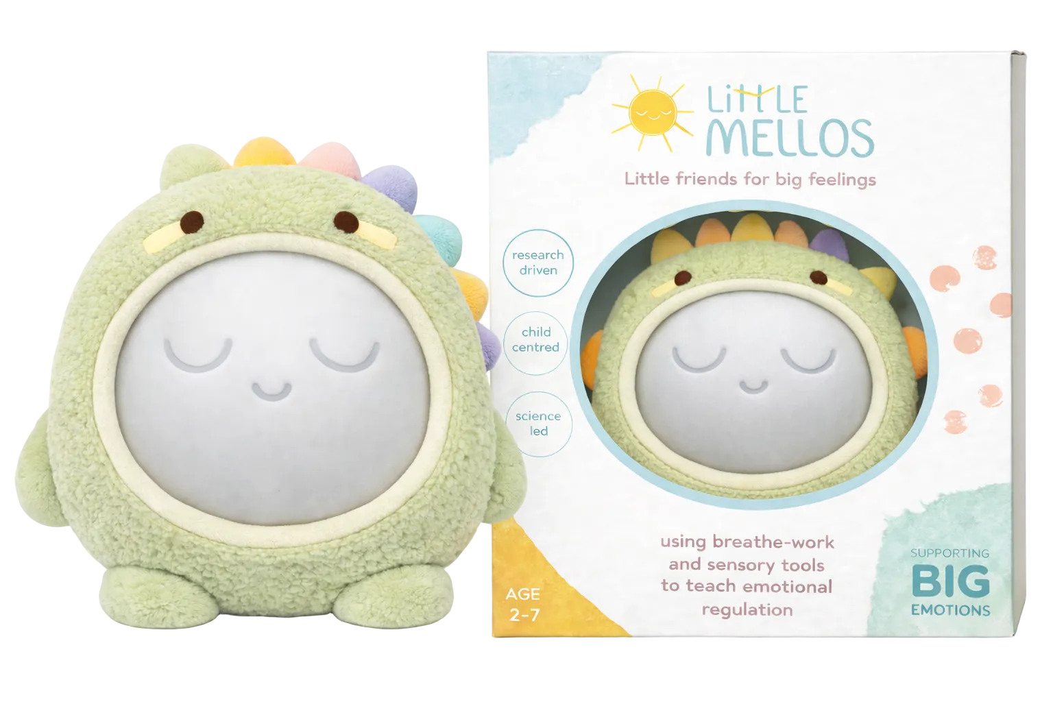Plush dinosaur toy with a soft gray face and colorful spikes next to its packaging on a white background